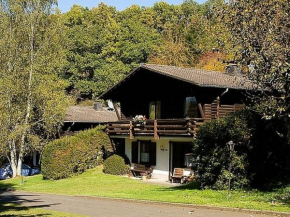 Tidy chalet with fireplace, located in wooded area